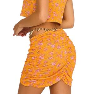Beach Bunny Saddie Mini Skirt orange floral with gold metal accent